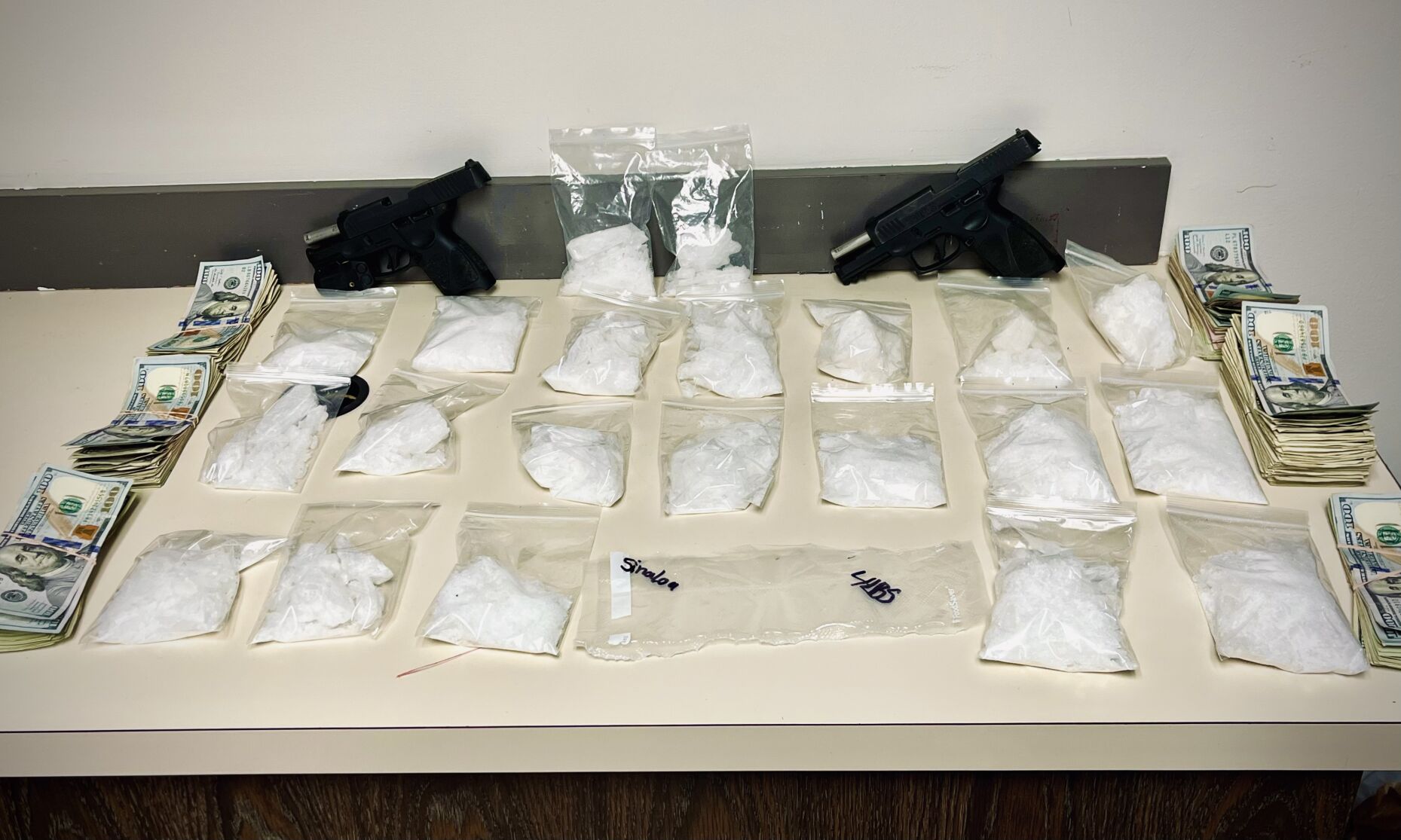 Confiscated drugs, guns and cash
